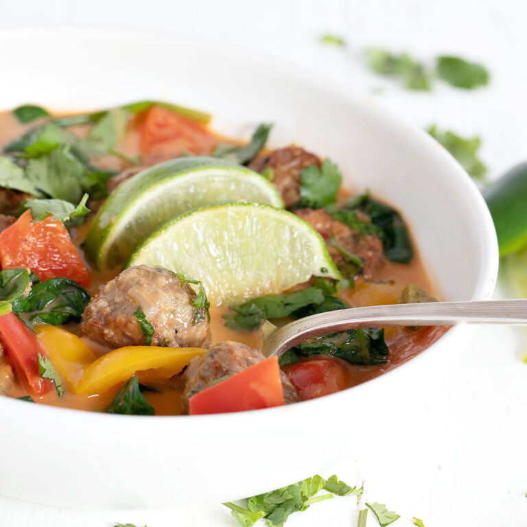 Thai meatball soup in white bowl