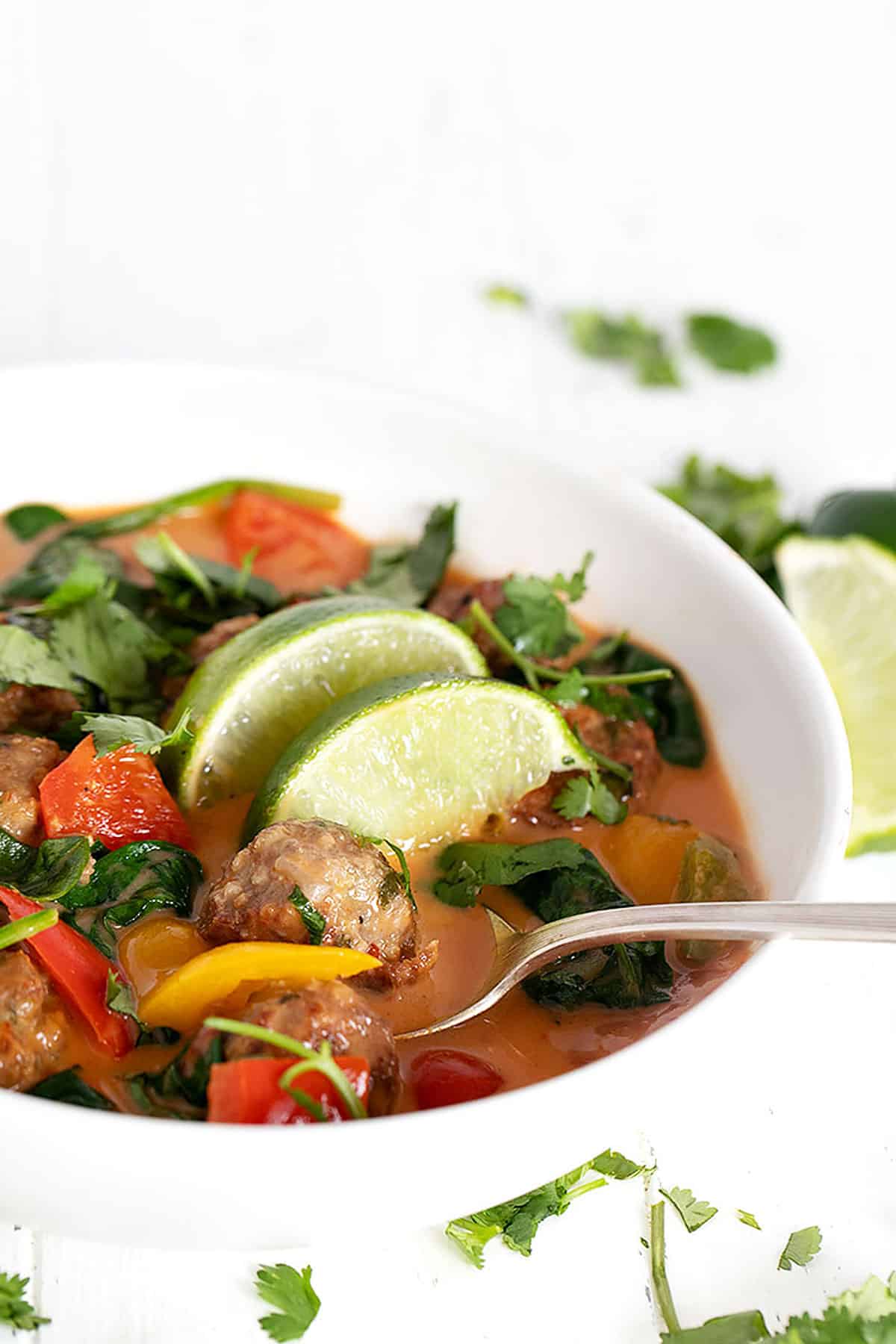 Thai meatball soup in white bowl