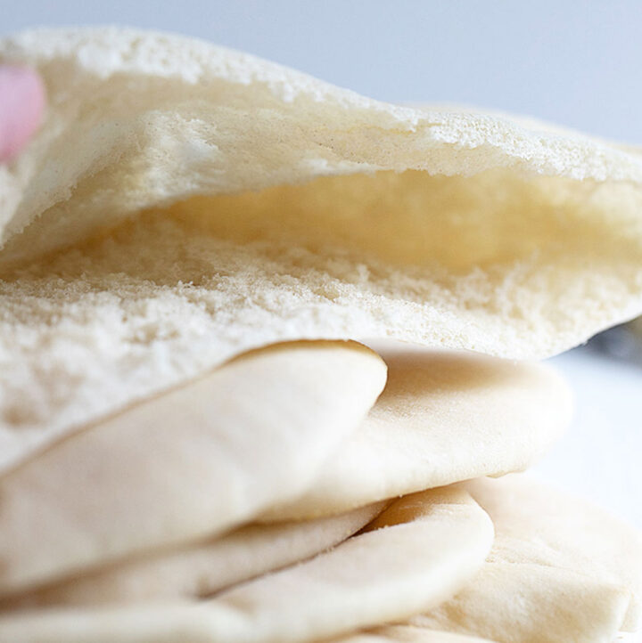 homemade pita breads sliced and showing pocket