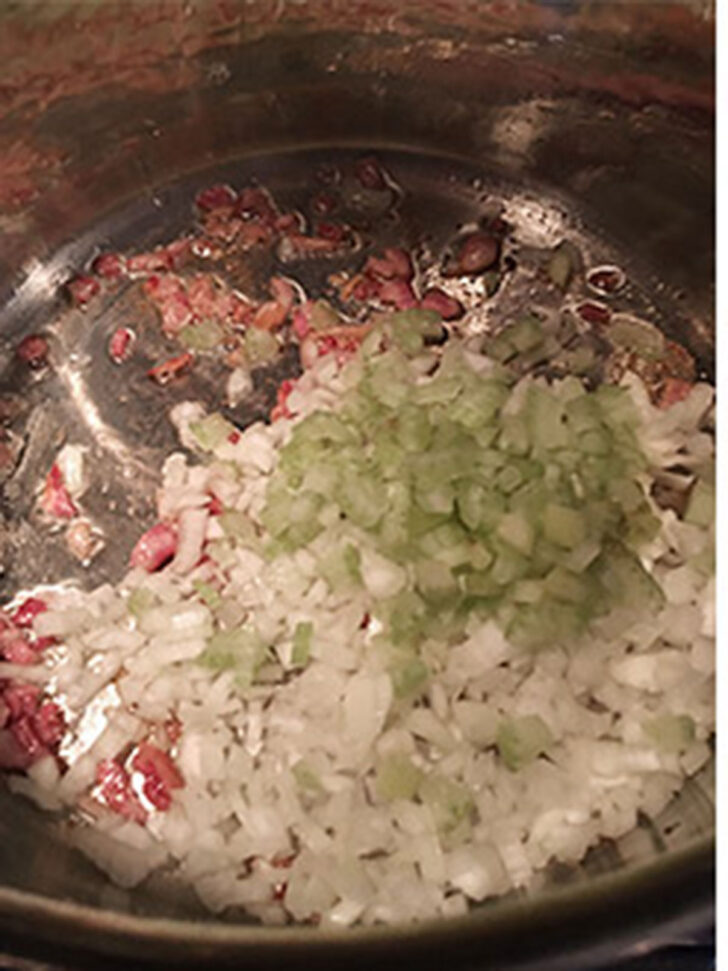 Celery and onion added to the pot.