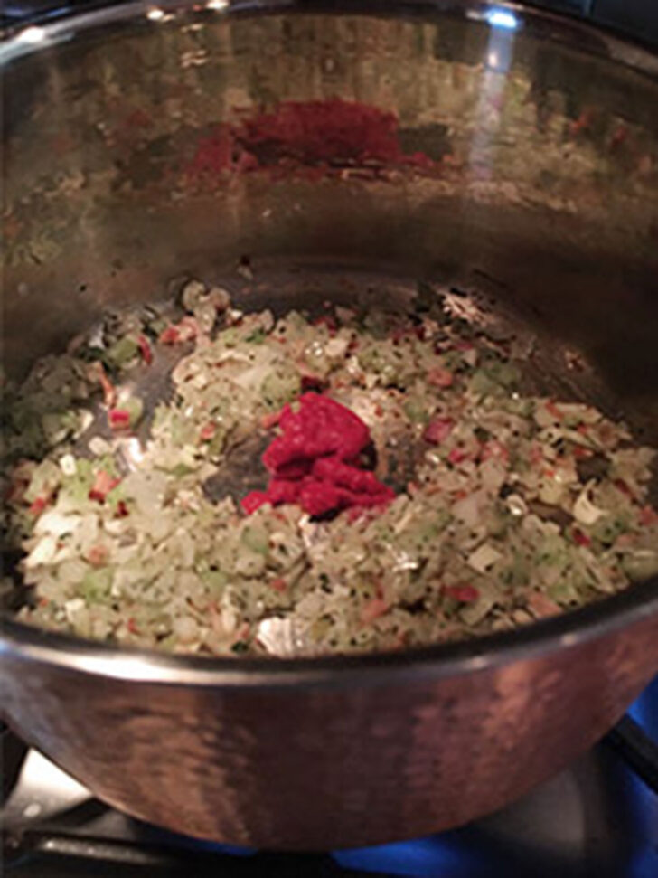 Tomato paste was added to the pot.