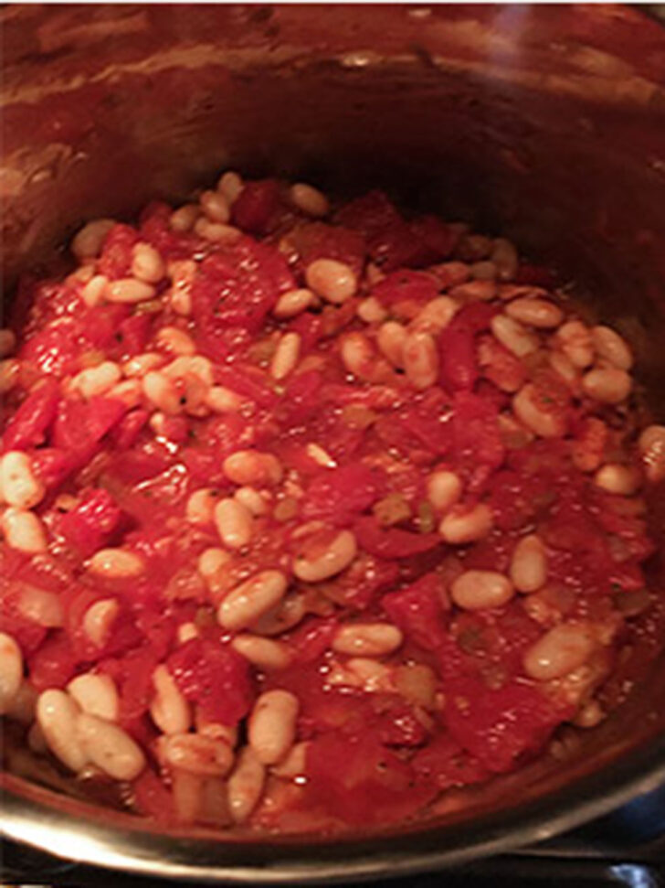 Fagioli soup is cooking in the pot.