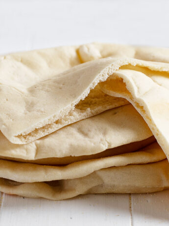 homemade pita breads with pockets stacked