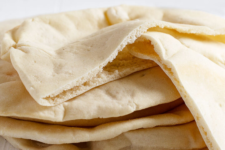 homemade pita breads with pockets stacked