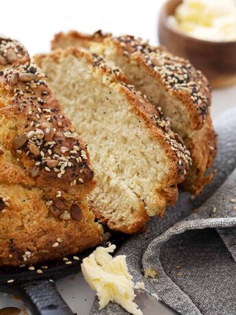 seeded no yeast bread in skillet sliced with butter
