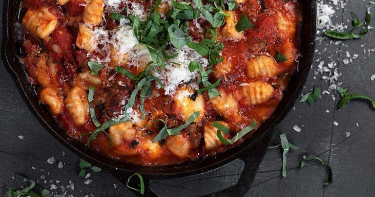 baked gnocchi with sausage in cast iron skillet