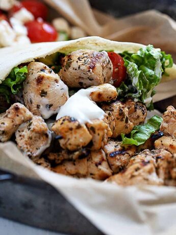 chicken souvlaki in pita on platter