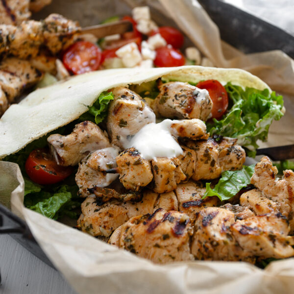 Chicken souvlaki pitas on a serving platter.