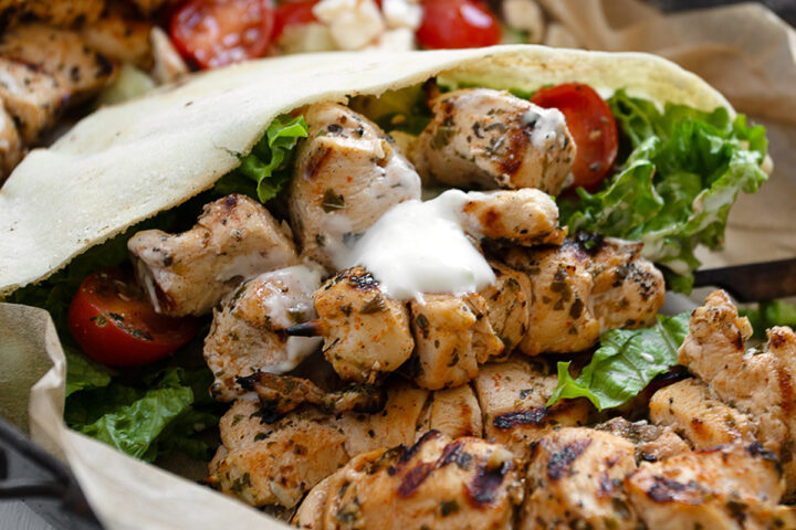 Chicken souvlaki pitas on a serving platter.