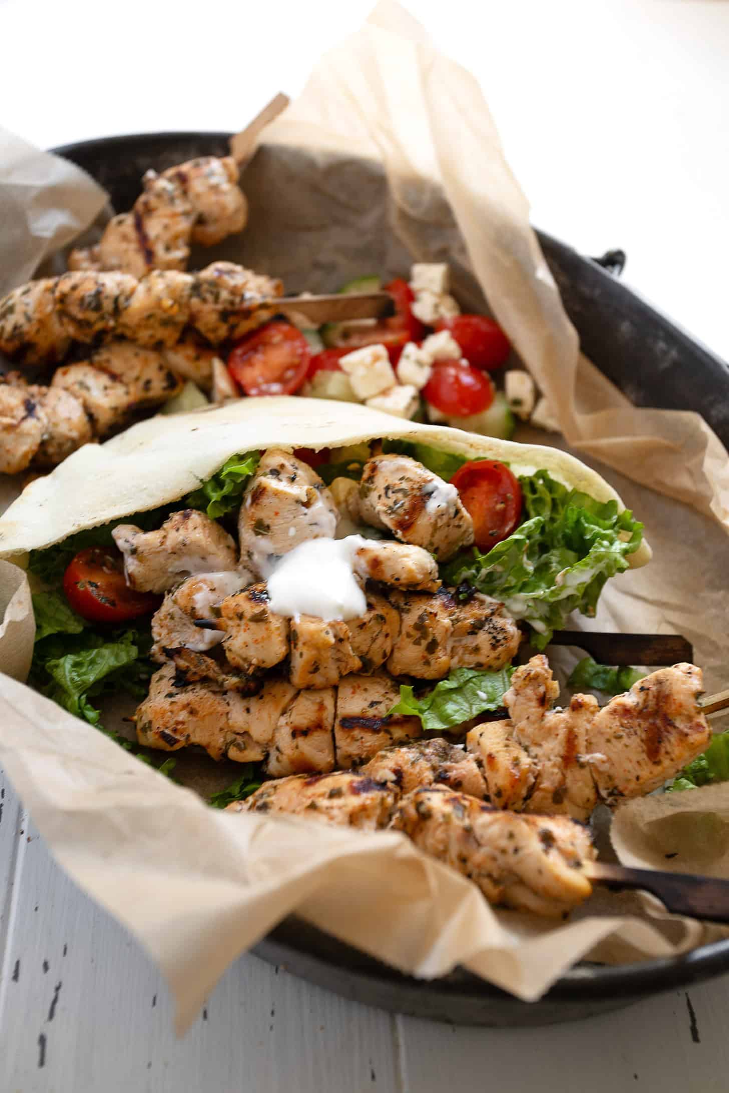 Chicken souvlaki pitas on a serving platter.