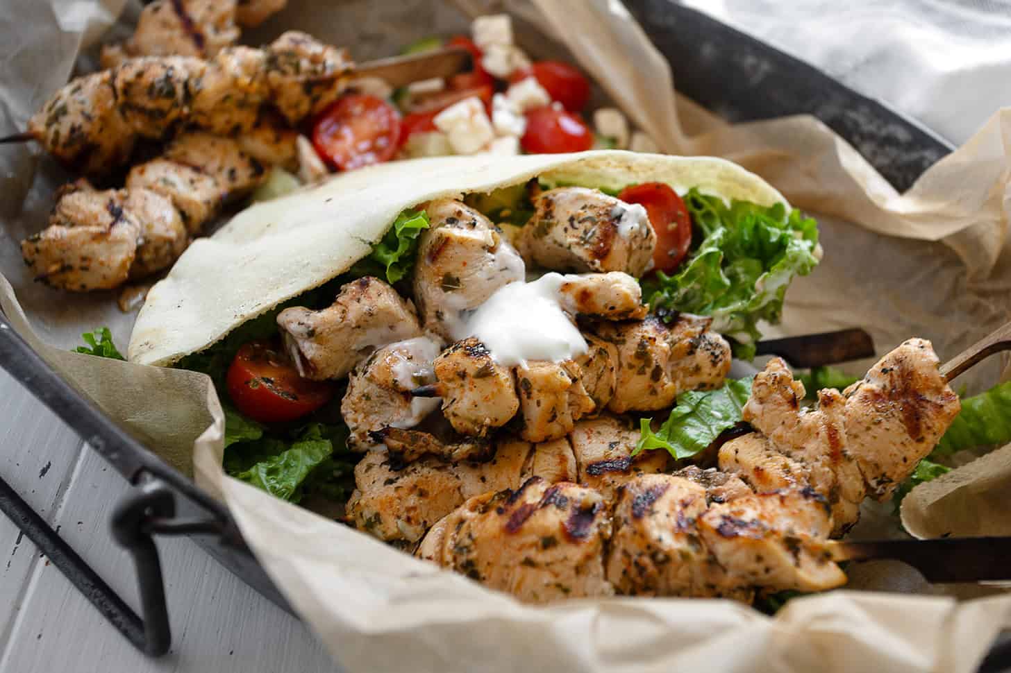 Chicken souvlaki pitas on a serving platter.