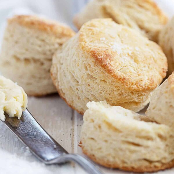 flaky buttermilk biscuits with knife and butter
