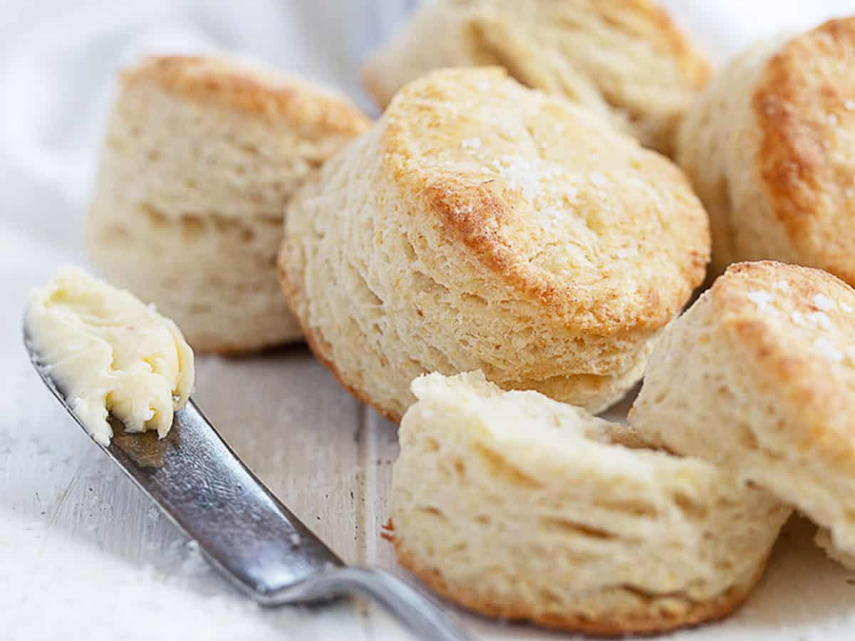 flaky buttermilk biscuits with knife and butter
