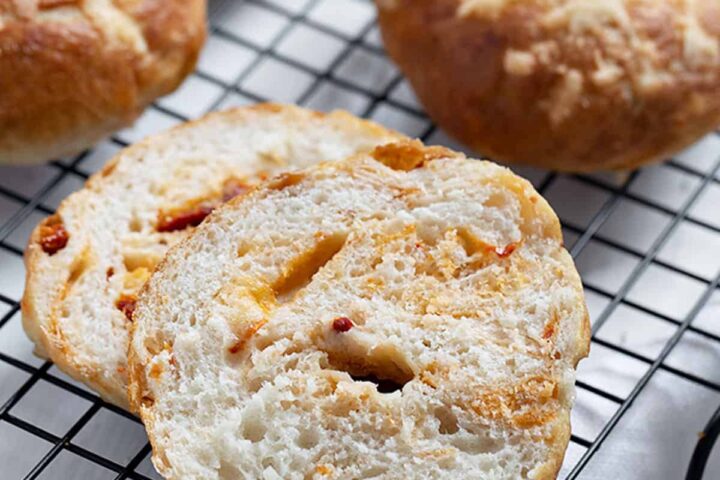 asiago sun dried tomato bagels on cooling rack