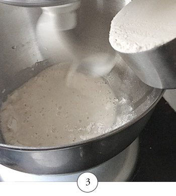 adding additional flour to the dough