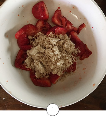 brown sugar and smashed strawberries in bowl 