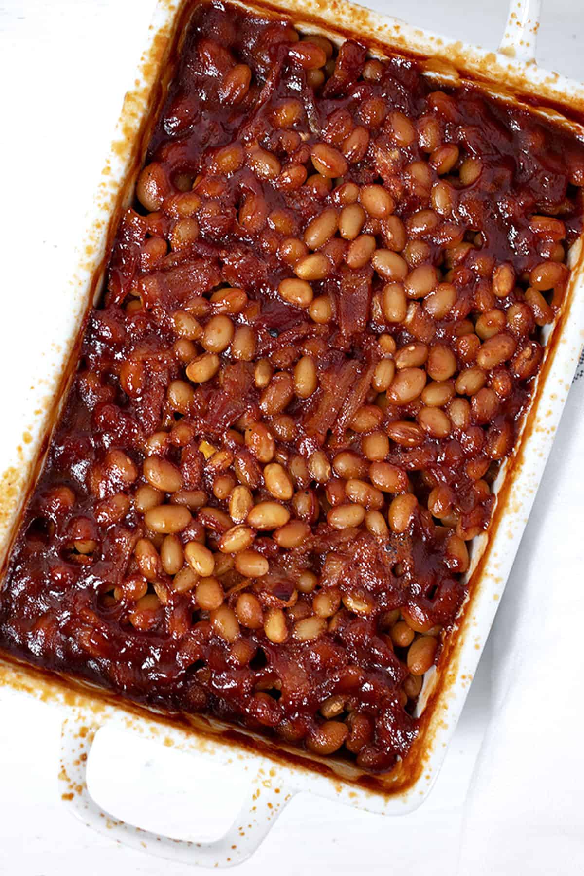 bbq baked beans with bacon in casserole dish