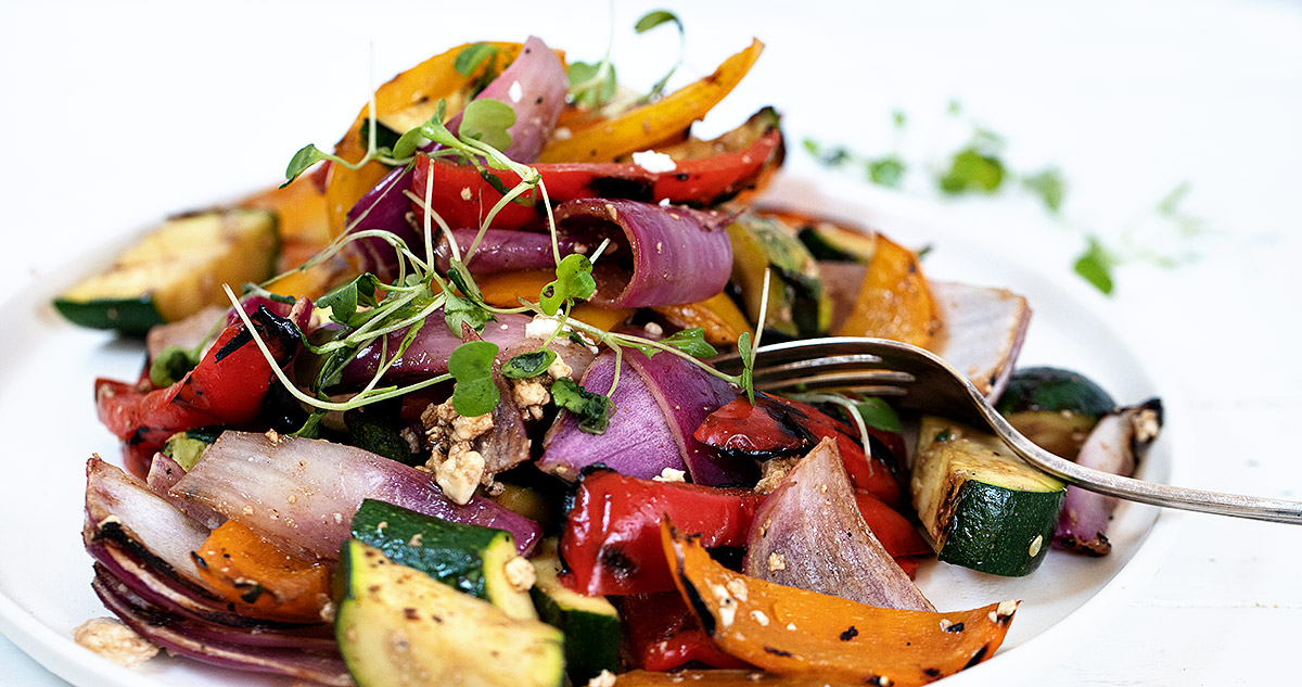 grilled vegetable salad in white bowl