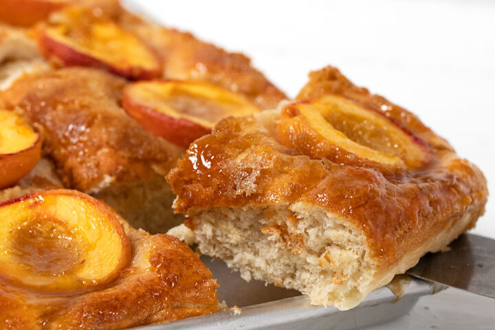 Baltimore peach cake sliced on sheet pan