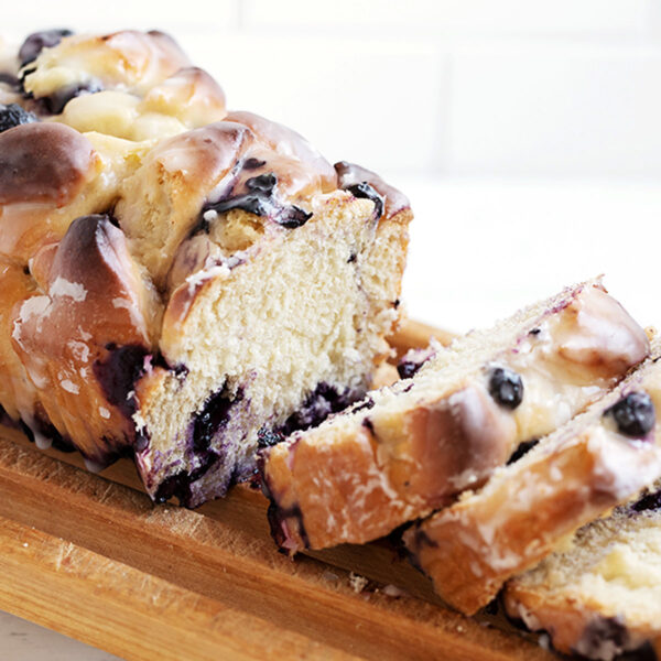 blueberry fritter bread sliced on cutting rack