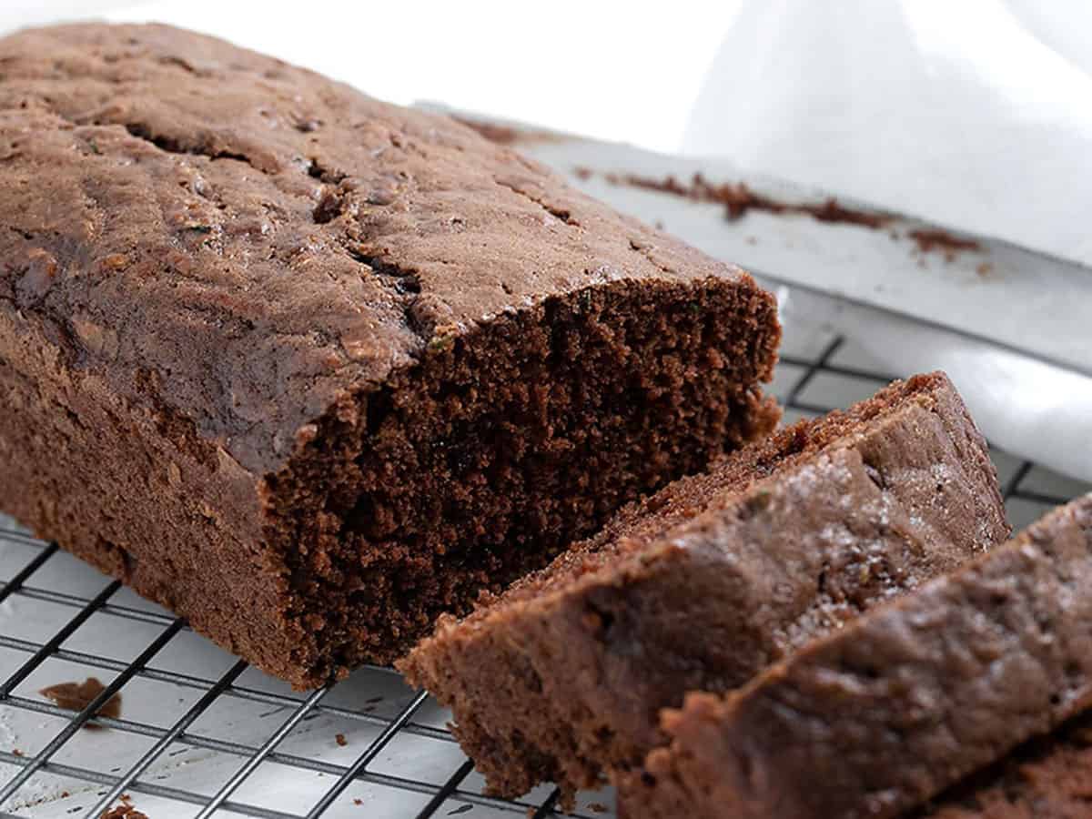 chocolate zucchini loaf sliced on cooling rack