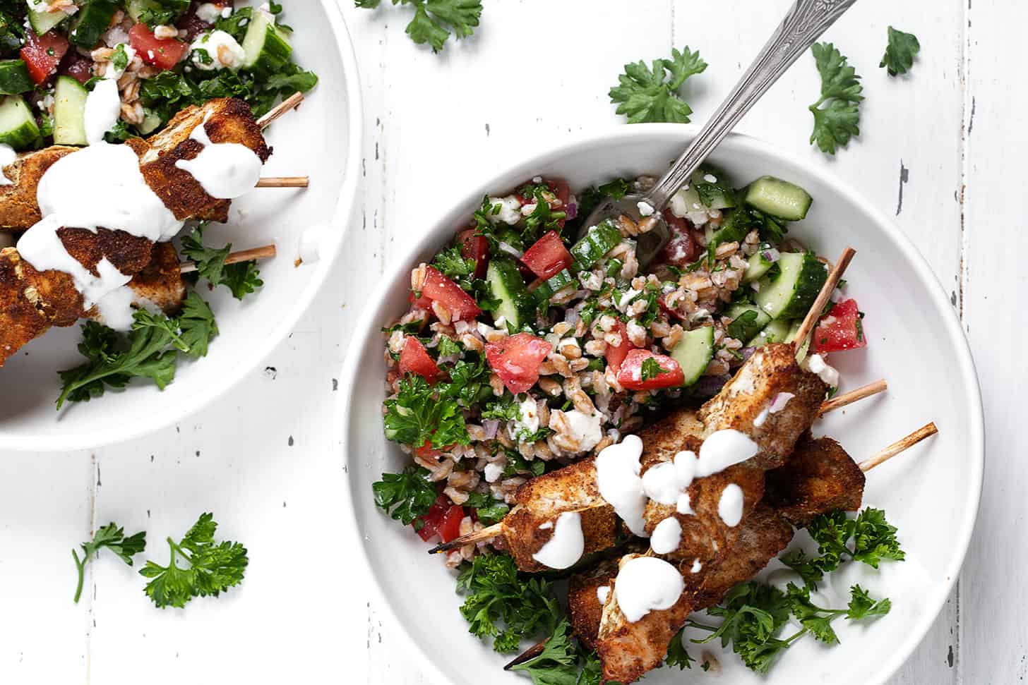 shawarma chicken kebabs on plate with tabbouleh