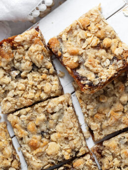 Old-fashioned date squares cut on serving board.