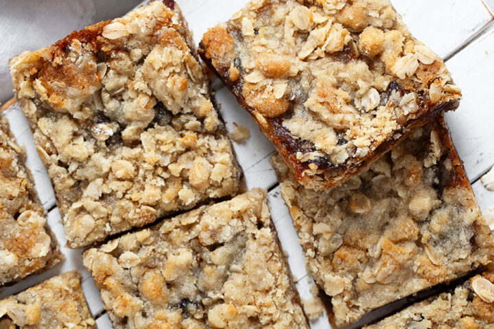 Old-fashioned date squares cut on serving board.