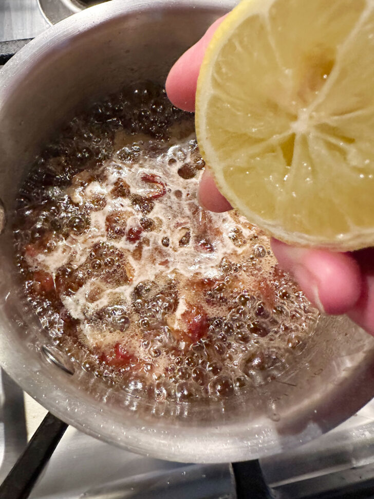Adding lemon juice to date filling.