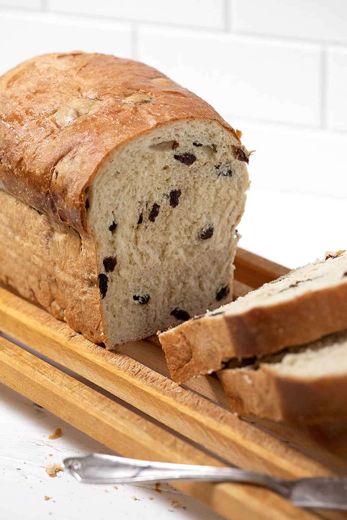 raisin bread sliced on cutting board