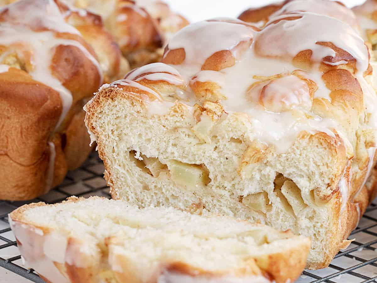 chunky apple bread sliced on cooling rack