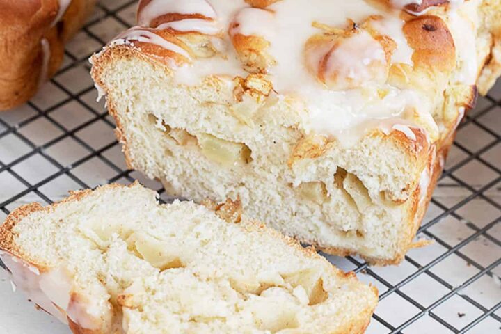 chunky apple bread sliced on cooling rack