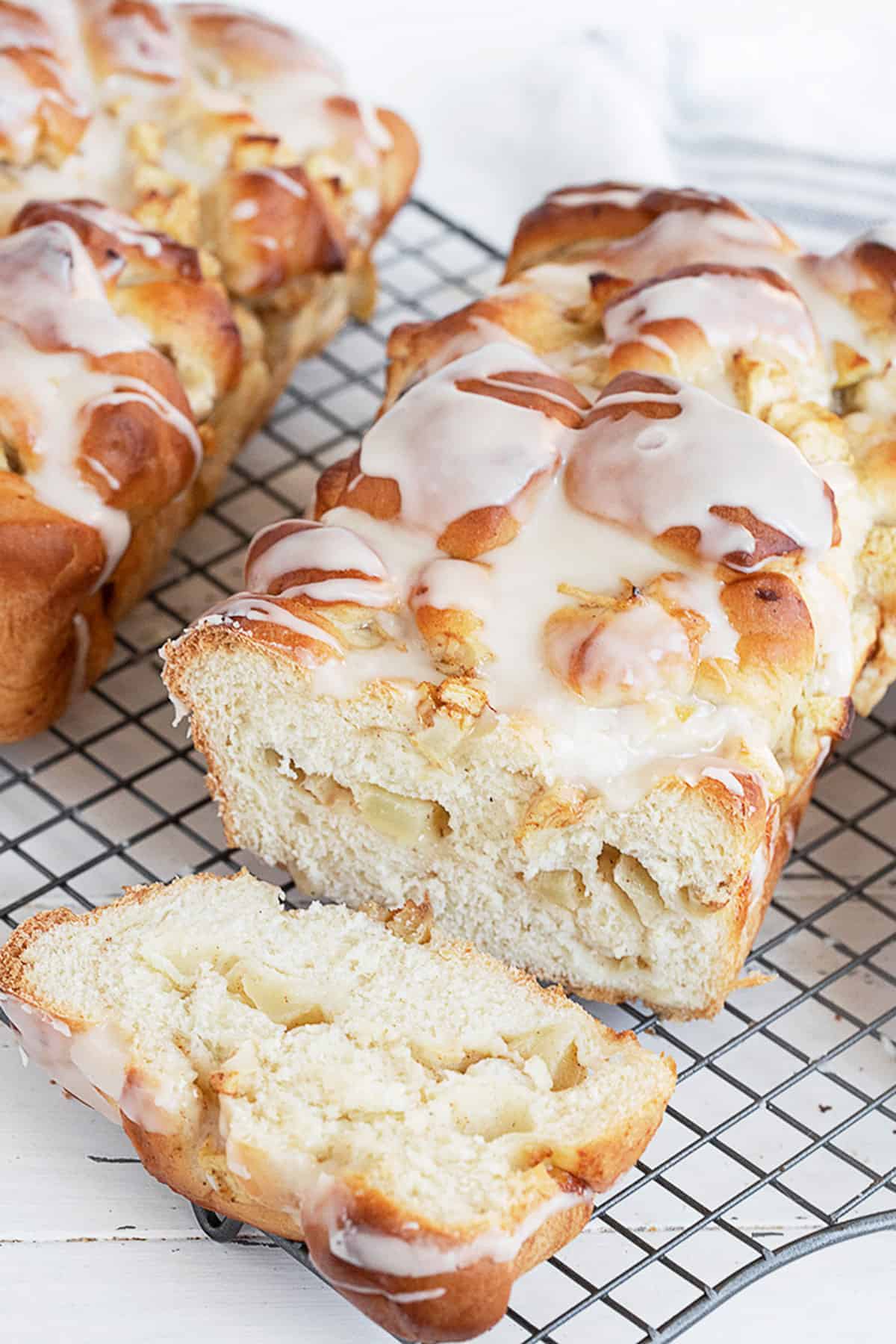 chunky apple bread sliced on cooling rack