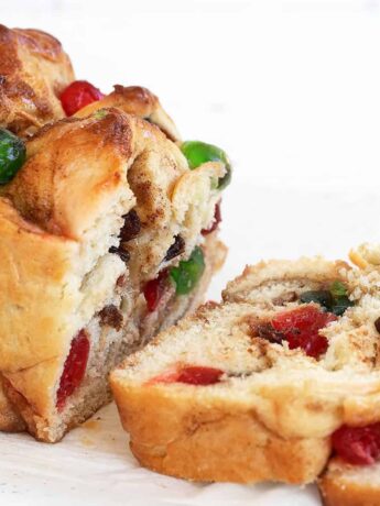yeast bread with glace cherries on cooling rack