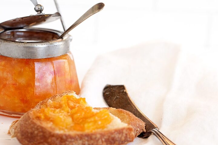 orange marmalade in jar and on toast