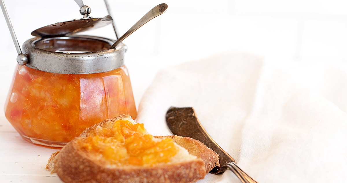 orange marmalade in jar and on toast