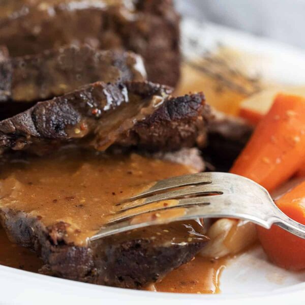 pot roast sliced on plate with carrots