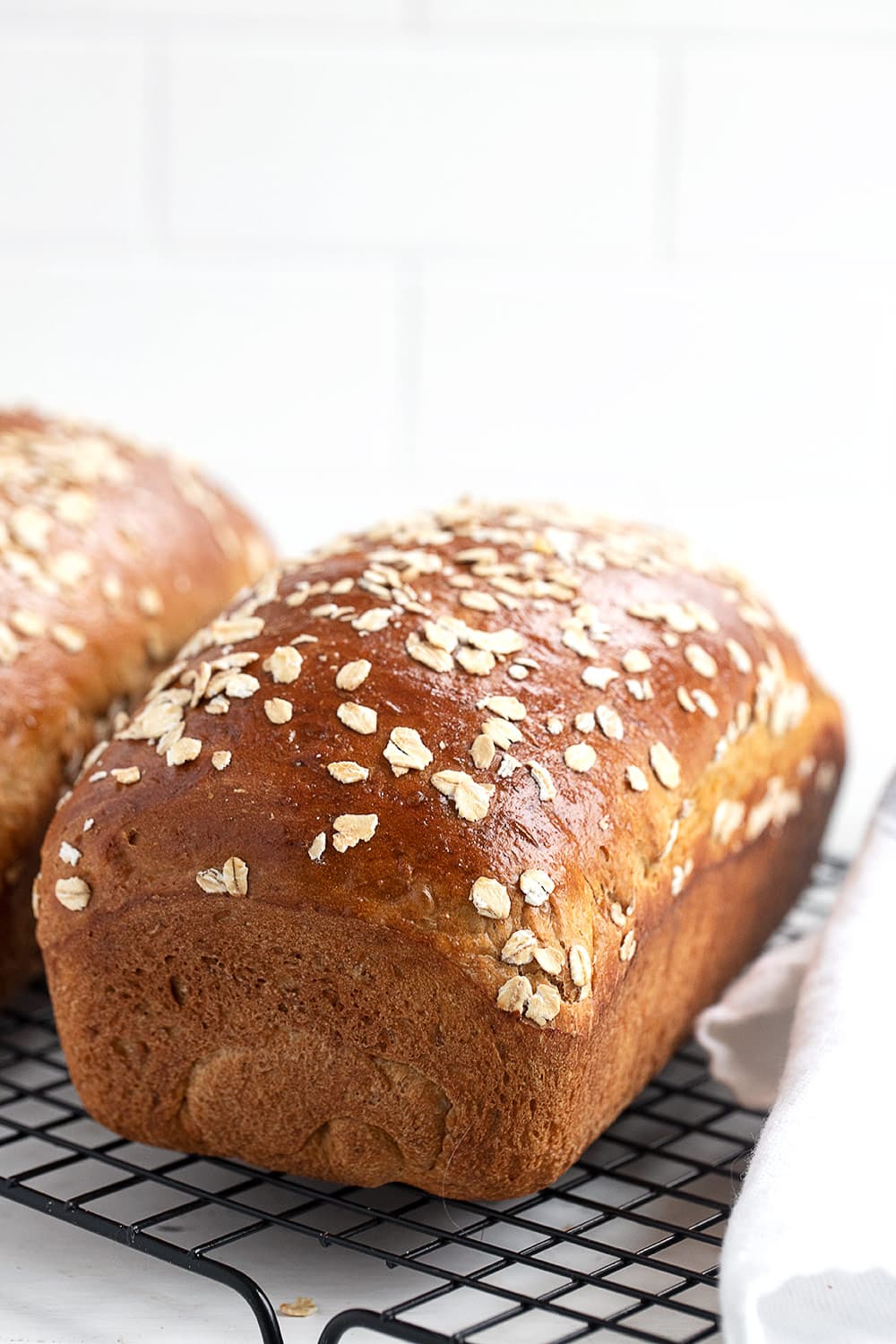 oatmeal molasses bread on cooling rack