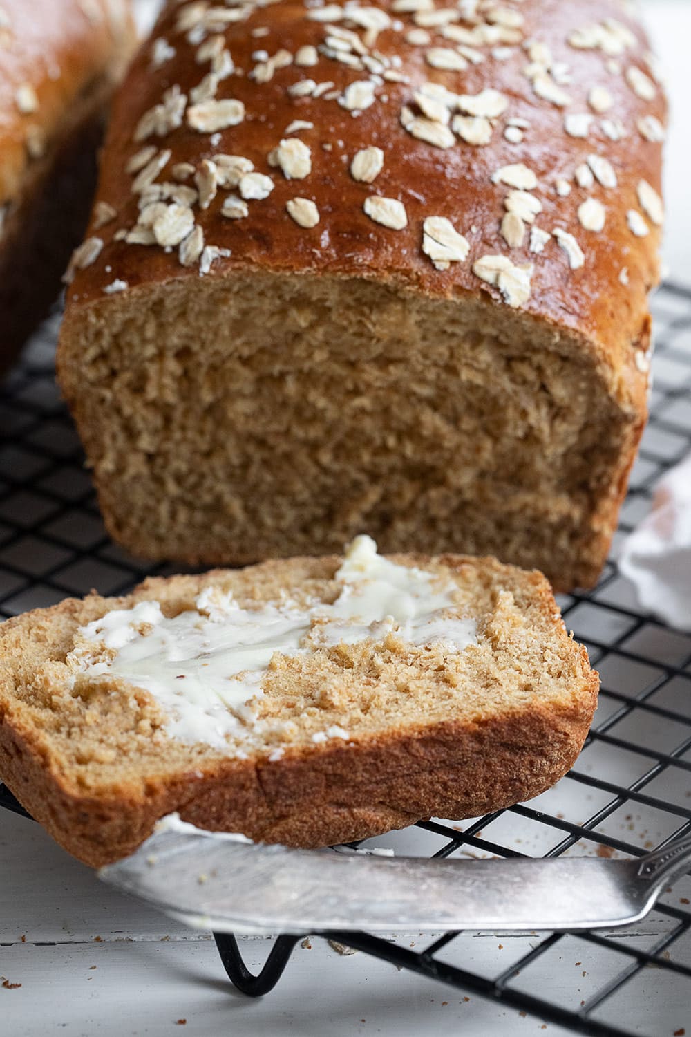 oatmeal molasses bread sliced and buttered