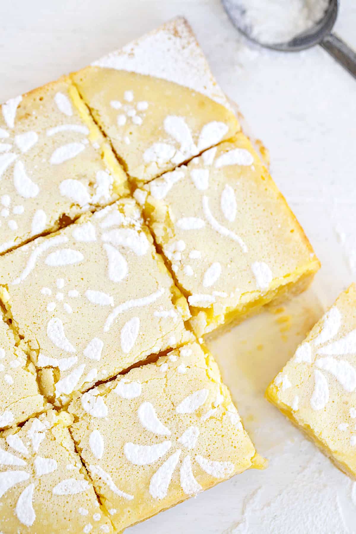 lemon squares cut on parchment