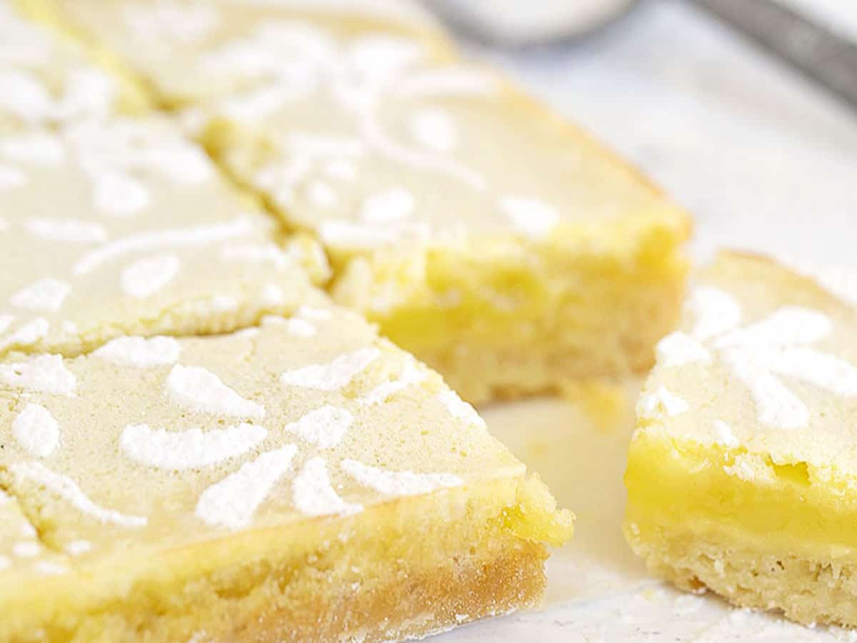 lemon squares cut on parchment