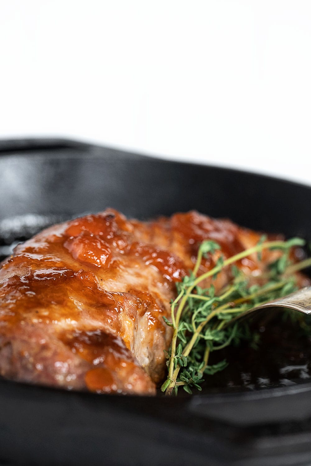 apricot mustard glazed pork in cast iron skillet