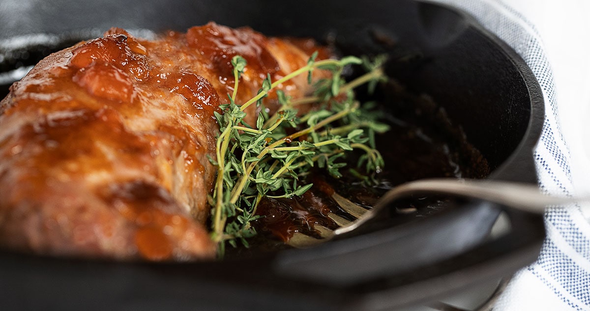 apricot mustard glazed pork in cast iron skillet