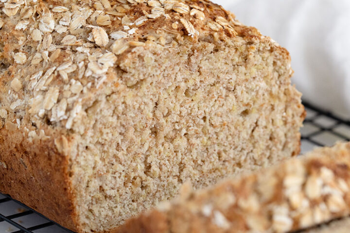 Irish brown soda bread sliced on cooling rack