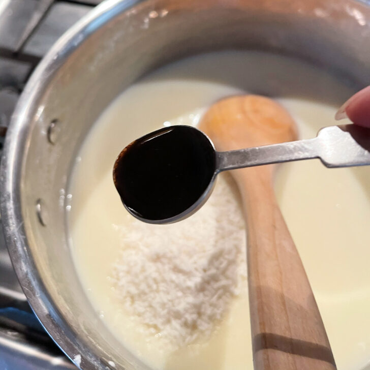 Finishing the pudding with coconut and vanilla.