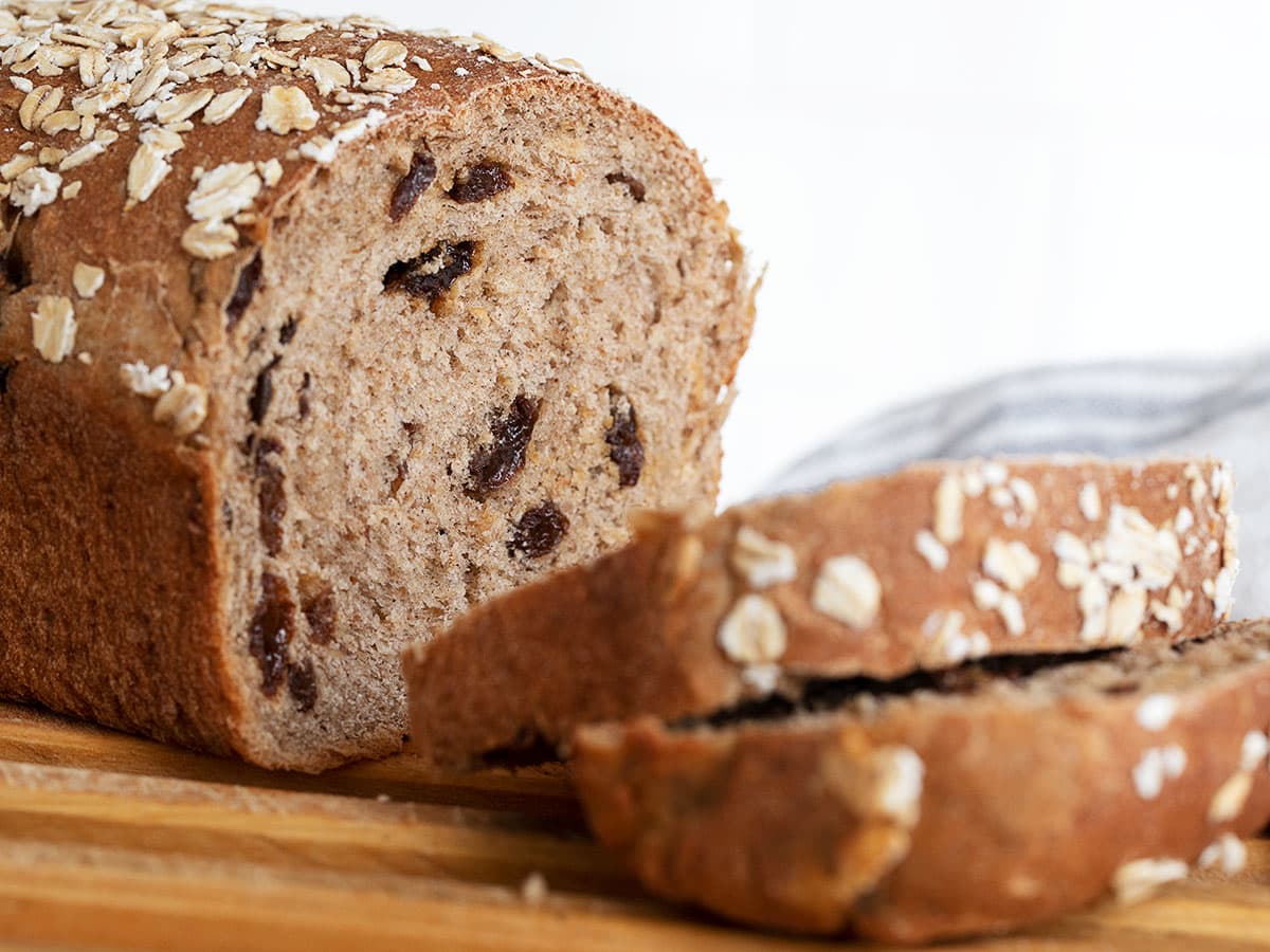 cinnamon raisin oatmeal bread sliced on cutting board