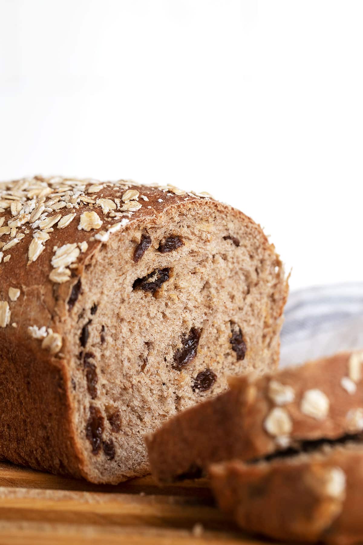 cinnamon raisin oatmeal bread on cutting board sliced