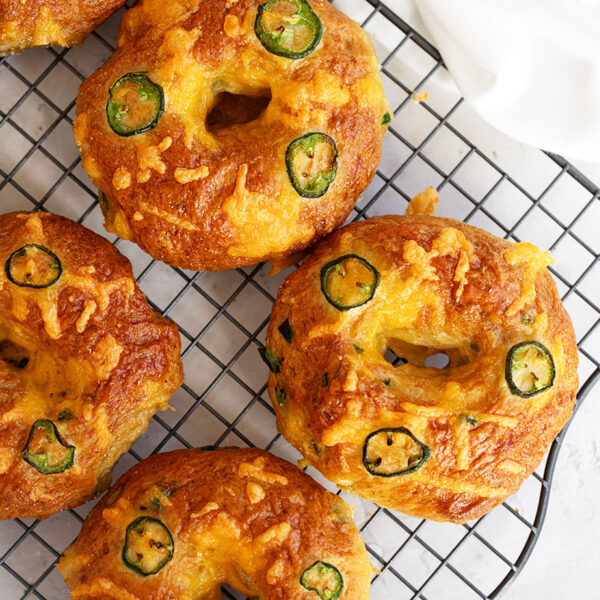 jalapeno cheddar bagels on wire rack