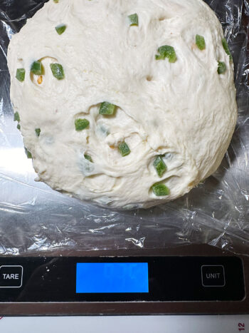 dough being weighed after rising