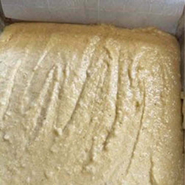 Old-fashioned Johnny cake batter in the baking pan before baking.